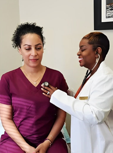 doctor smiling while checking the health of the woman