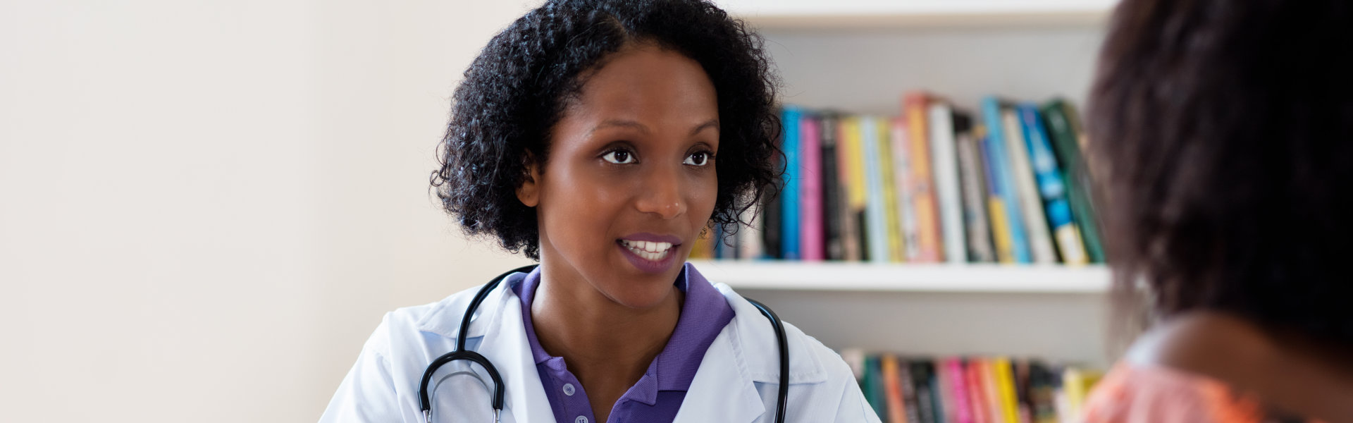 Mature african american female doctor recommending stay at home