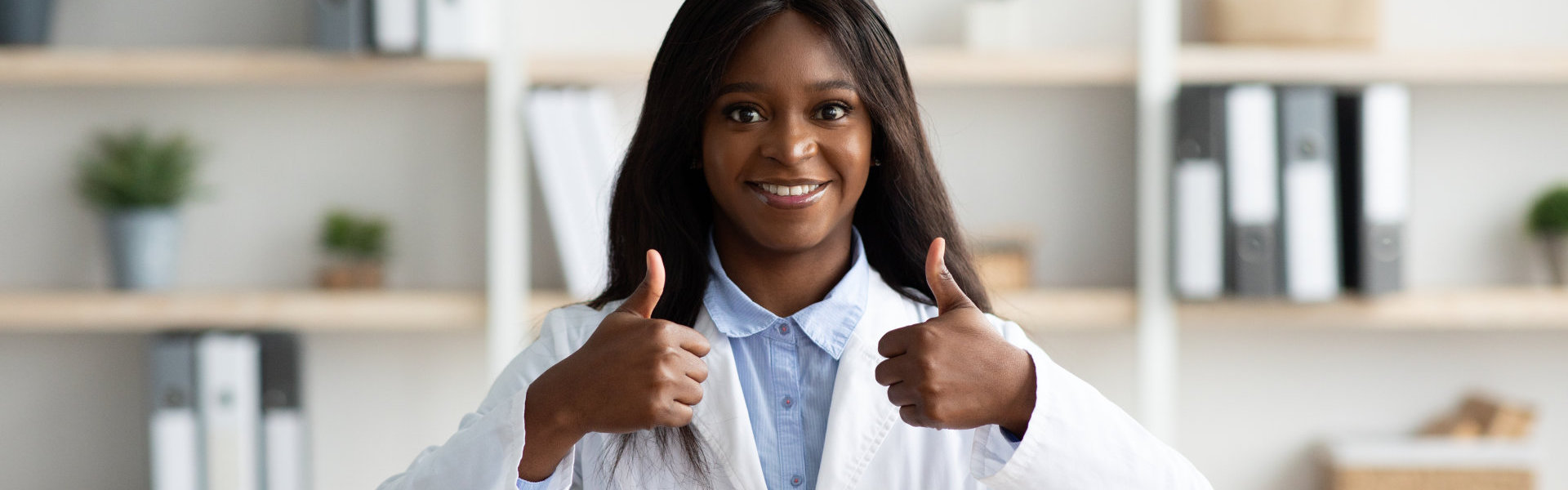 doctor smiling doing thumbs up